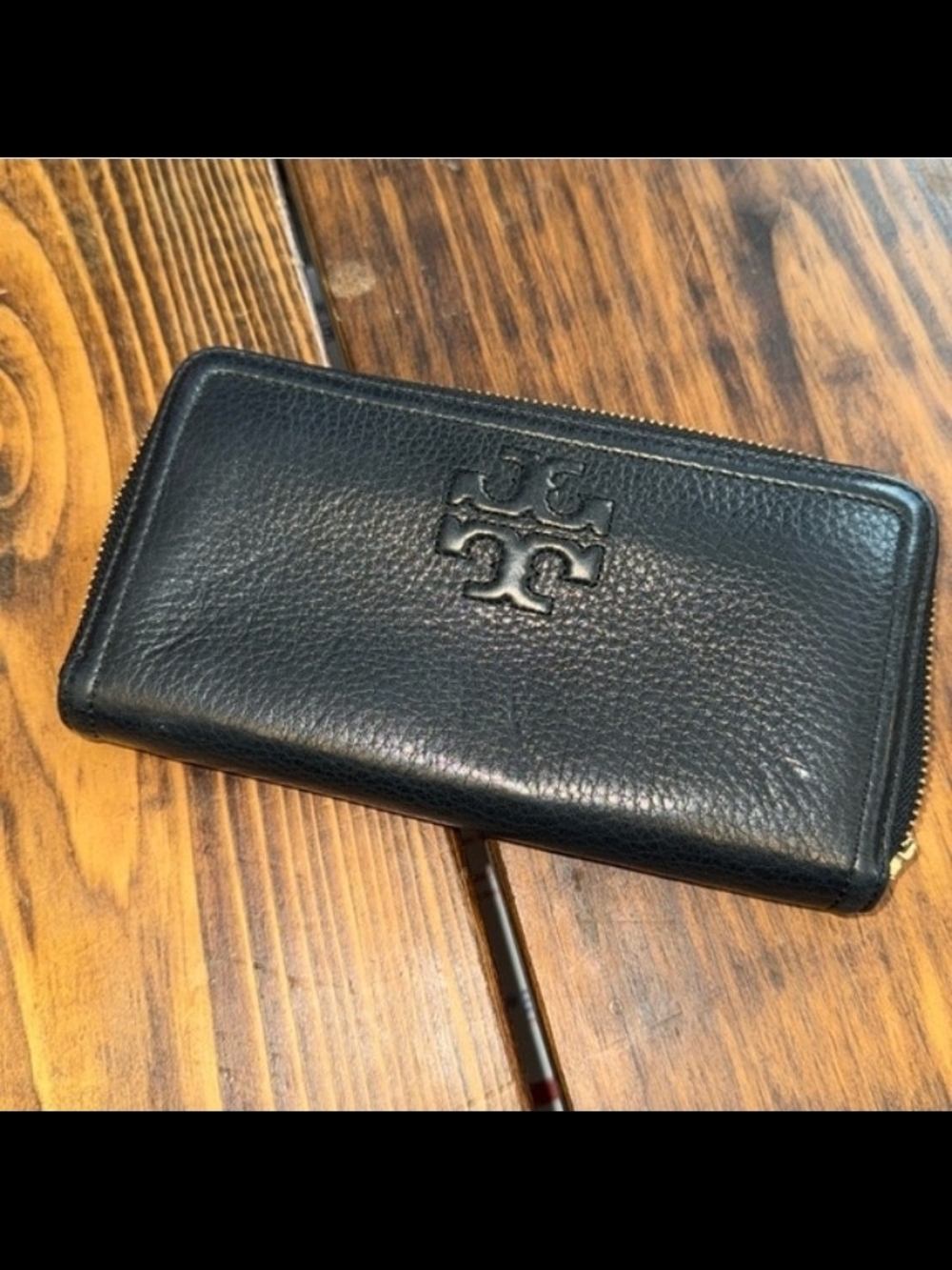 Torv Burch black wallet with zipper. Gently worn